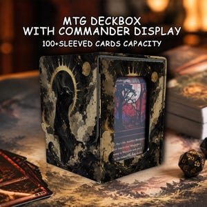 May include: A black and gold MTG deckbox with a commander display window and 100+ sleeved cards capacity. The box features a graphic of a black cat with a golden halo, and a trading card is visible through the front-facing rectangular cutout.