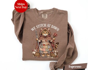 We Stitch At Dawn Shirt, Sewer Cat Shirt, Funny Sewing Shirt, Cat Lover Gift, Fantasy Sewing Shirt, Comfort Colors® Sewing Lover Shirt