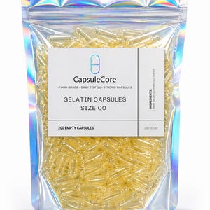 May include: A clear, resealable bag filled with numerous yellow gelatin capsules. The bag has a holographic, iridescent finish. A white label reads "CapsuleCore" and "Gelatin Capsules Size 00". The label also states "200 Empty Capsules".