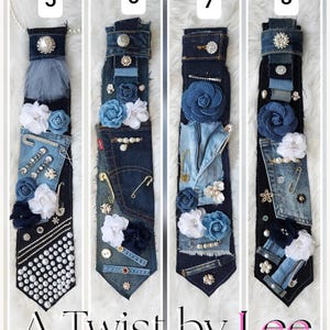 Puede incluir: Cuatro corbatas de mezclilla &uacute;nicas, cada una adornada con flores de tela, perlas y alfileres decorativos. Las corbatas son en tonos azules y negros, con el texto "A Twist by Lee" en la parte inferior. Cada corbata est&aacute; etiquetada como "SOLD" con un n&uacute;mero.