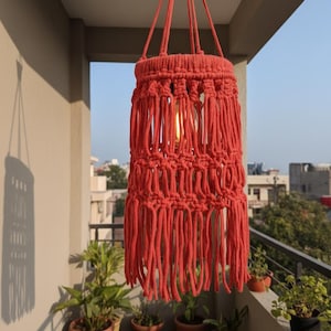 Handmade red macrame hanging lampshade with warm ambient light, boho cotton pendant lamp shade for cozy living room and bedroom decor