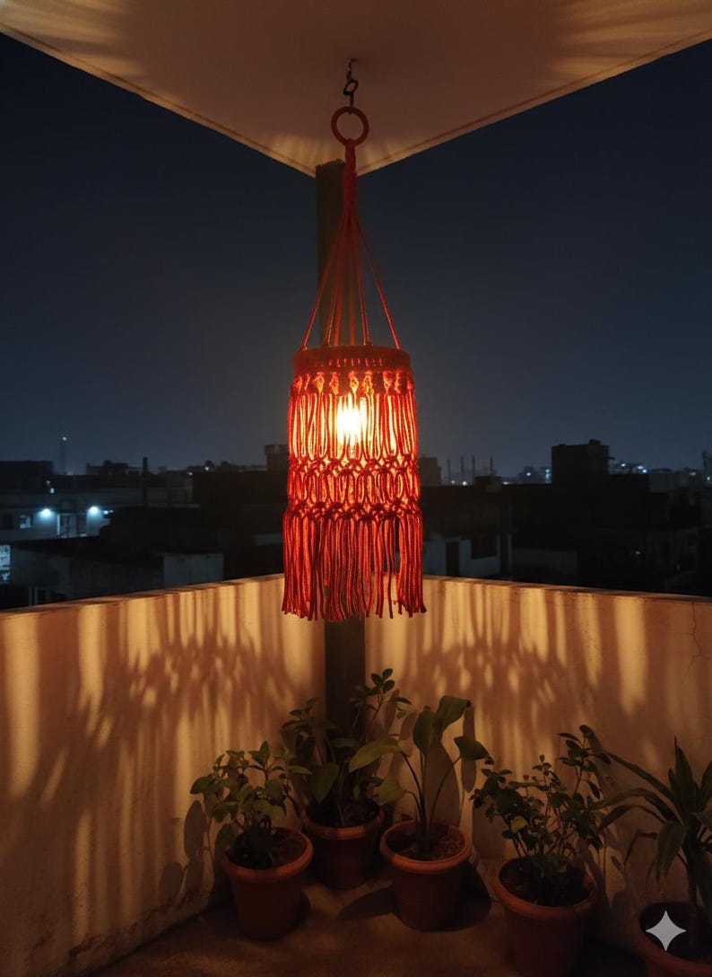 Handmade red macrame hanging lampshade with warm ambient light, boho cotton pendant lamp shade for cozy living room and bedroom decor