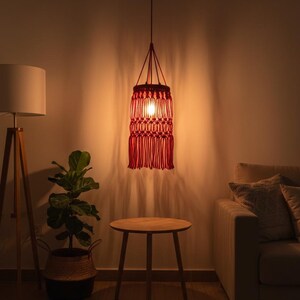 Handmade red macrame hanging lampshade with warm ambient light, boho cotton pendant lamp shade for cozy living room and bedroom decor