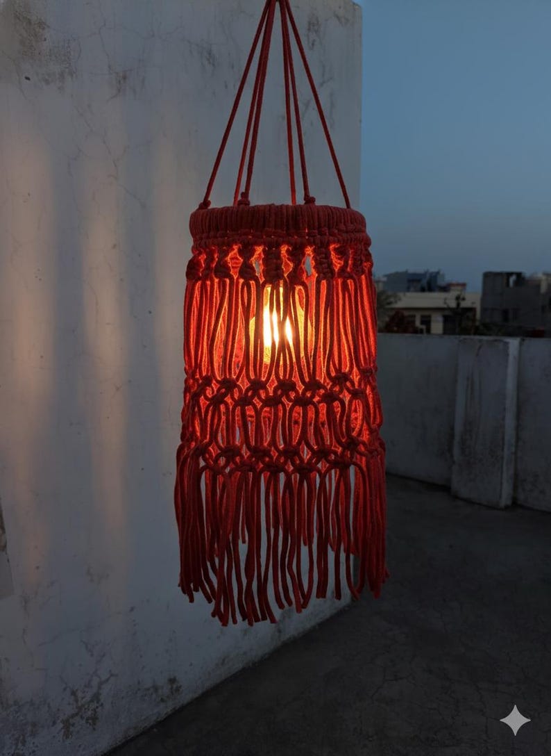 Handmade red macrame hanging lampshade with warm ambient light, boho cotton pendant lamp shade for cozy living room and bedroom decor