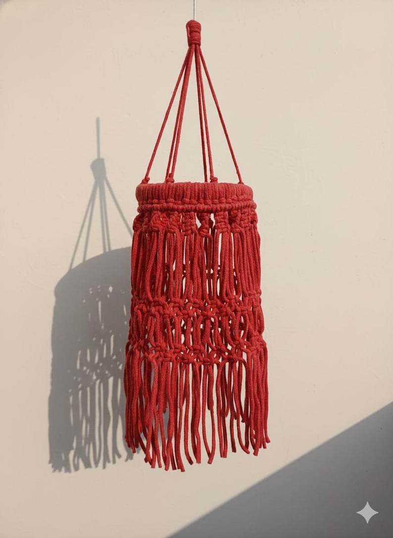 Handmade red macrame hanging lampshade with warm ambient light, boho cotton pendant lamp shade for cozy living room and bedroom decor