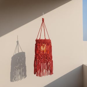 Handmade red macrame hanging lampshade with warm ambient light, boho cotton pendant lamp shade for cozy living room and bedroom decor