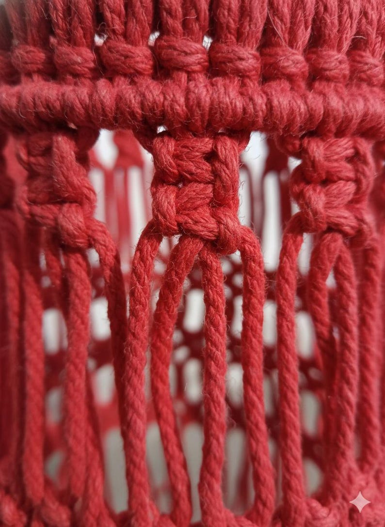 Handmade red macrame hanging lampshade with warm ambient light, boho cotton pendant lamp shade for cozy living room and bedroom decor