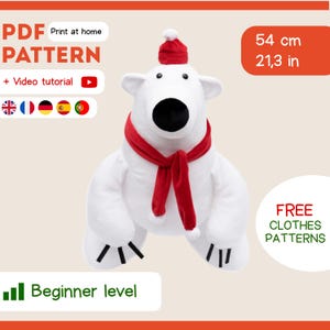 May include: A plush white polar bear wearing a red scarf and hat, with a black nose and small black claws. The image includes text that says "PDF PATTERN" and "Beginner level". The bear measures 21.3 inches (54 cm) tall.