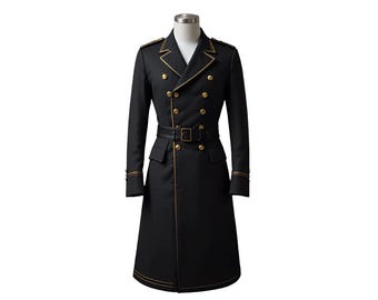 May include: A black military-style coat with gold trim and buttons. The double-breasted coat features a belted waist, shoulder epaulets, and gold accents on the cuffs. The coat is displayed on a mannequin.