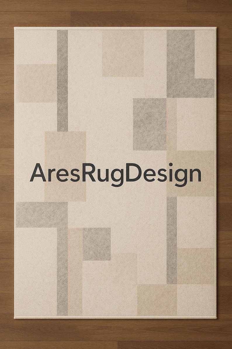 May include: A rectangular area rug with a geometric pattern in shades of beige, tan, and gray. The rug features a repeating design of squares and rectangles. The text "AresRugDesign" is printed in black across the center of the rug.