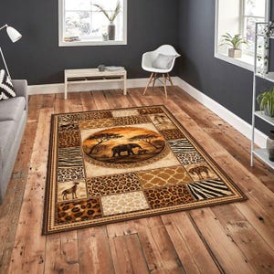May include: Rectangular area rug with an African safari theme. The rug features a central circular design with elephants and trees, surrounded by animal print patterns like leopard and zebra. The color palette includes browns, tans, and creams.