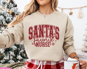 Sudadera navideña de enfermera favorita de Papá Noel, regalo navideño para enfermeras, personal médico de UCI, UCIN y urgencias, camiseta navideña de enfermera, regalo navideño para enfermeras.