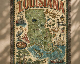 May include: A woven throw blanket featuring a map of Louisiana with illustrations of local landmarks, food, and wildlife. The word "LOUISIANA" is at the top in a vintage font. The blanket has a fringed edge and a neutral color palette.