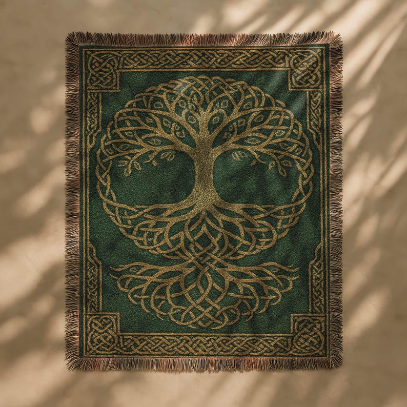 May include: A green throw blanket with a gold Celtic tree of life design. The tree is centered on the blanket, surrounded by a gold border with Celtic knot patterns. The blanket has a fringed edge.