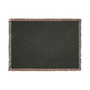 May include: A dark gray woven throw blanket with a textured pattern. The blanket has a fringed edge with a mix of colors including red, brown, and gray. The blanket is rectangular and appears to be made of a soft material.