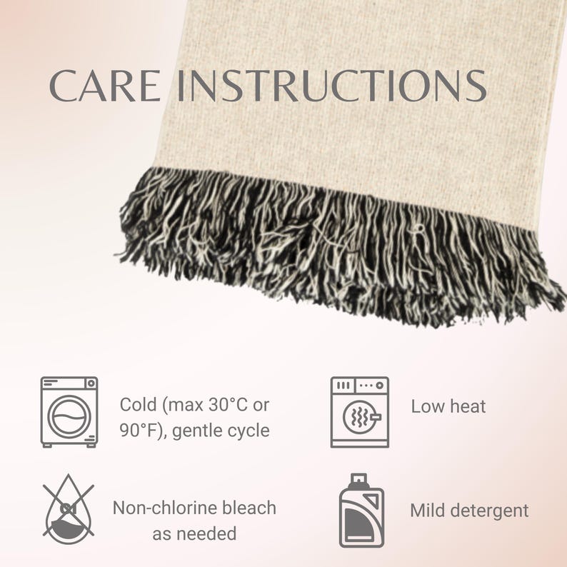 May include: A beige throw blanket with black fringe. The image includes care instructions: cold wash (max 90&deg;F), gentle cycle, low heat, non-chlorine bleach as needed, and mild detergent.