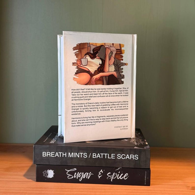 May include: A stack of three books with a white book on top featuring an illustration of two people with a coffee cup and a book. The middle book is black with the title "BREATH MINTS / BATTLE SCARS". The bottom book is black with the title "Sugar & spice".