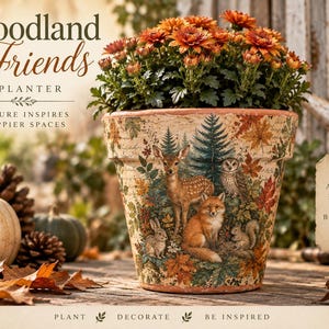 May include: A terracotta planter featuring a woodland scene with a deer, fox, owl, and rabbit surrounded by autumn leaves and pine trees. The planter displays the text Woodland Friends Planter, Nature Inspires Happier Spaces, and A Little Nature For A Brighter Day.
