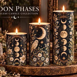 May include: Three cylindrical flameless candles with a dark blue background, featuring gold moon phases, white flowers, and an owl illustration. The text reads MOON PHASES FLAMELESS CANDLE COLLECTION. Each candle has a glowing light on top.