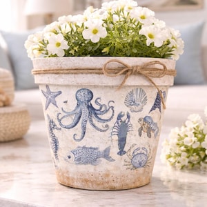May include: A set of three ceramic mugs with a speckled, matte finish. Each mug features a different color: light blue, cream, and gray. The mugs have a simple, modern design, suitable for coffee or tea.