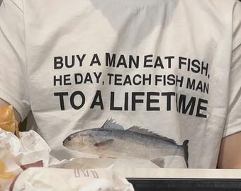 Buy a Man Eat Fish shirt Funny Meme Shirt Inappropriate Shirt Unhinged Shirt Weird Shirt Ironic Shirt Sarcastic Shirt Funny Gift Gen Z Shirt