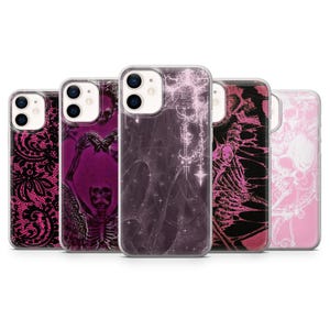 May include: A collection of five phone cases with various designs. The cases feature a range of gothic and macabre themes, including lace patterns, skeletons, and abstract designs in shades of pink, black, and purple. The cases are made of clear plastic.