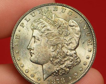 Dólar de plata Morgan de 1878-CC – Moneda rara acuñada en la Casa de la Moneda de Carson City, pieza de colección estadounidense icónica.