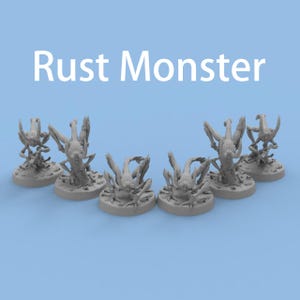 May include: Six grey Rust Monster miniatures on a light blue backdrop. Each miniature has a detailed, multi-limbed creature design. The text "Rust Monster" is displayed in white at the top of the image.
