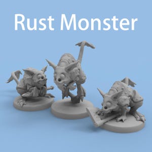 May include: Three unpainted gray miniature figures labeled Rust Monster. Each creature features a segmented, armored body, pointed ears, large circular eyes, and a long tail. One figure holds a small axe, while another holds a short blade.