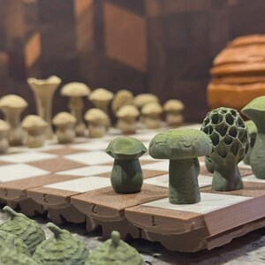 May include: A unique chess set featuring mushroom-shaped pieces in shades of green and tan. The board has a brown and white checkered pattern. The pieces are arranged on the board, ready for play. The set is a creative take on a classic game.