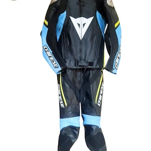 May include: A set of three ceramic mugs with a speckled, matte finish. The mugs are in shades of cream, light gray, and dark gray. Each mug has a simple, minimalist design and a rounded handle. The mugs are likely for coffee or tea.