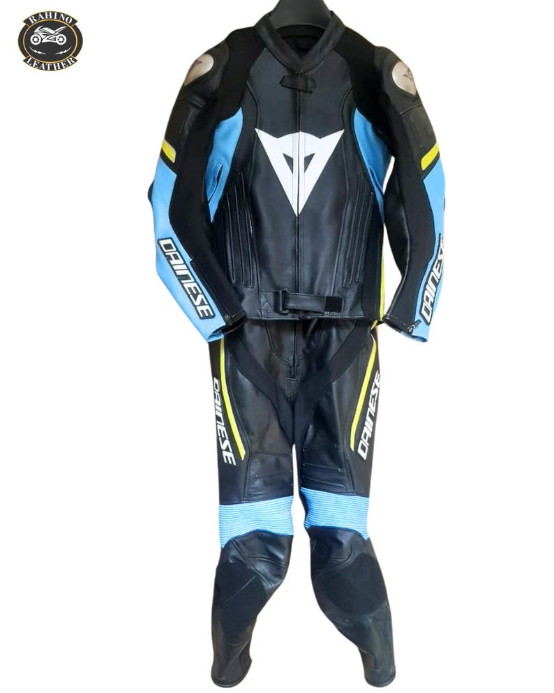 May include: A set of three ceramic mugs with a speckled, matte finish. The mugs are in shades of cream, light gray, and dark gray. Each mug has a simple, minimalist design and a rounded handle. The mugs are likely for coffee or tea.