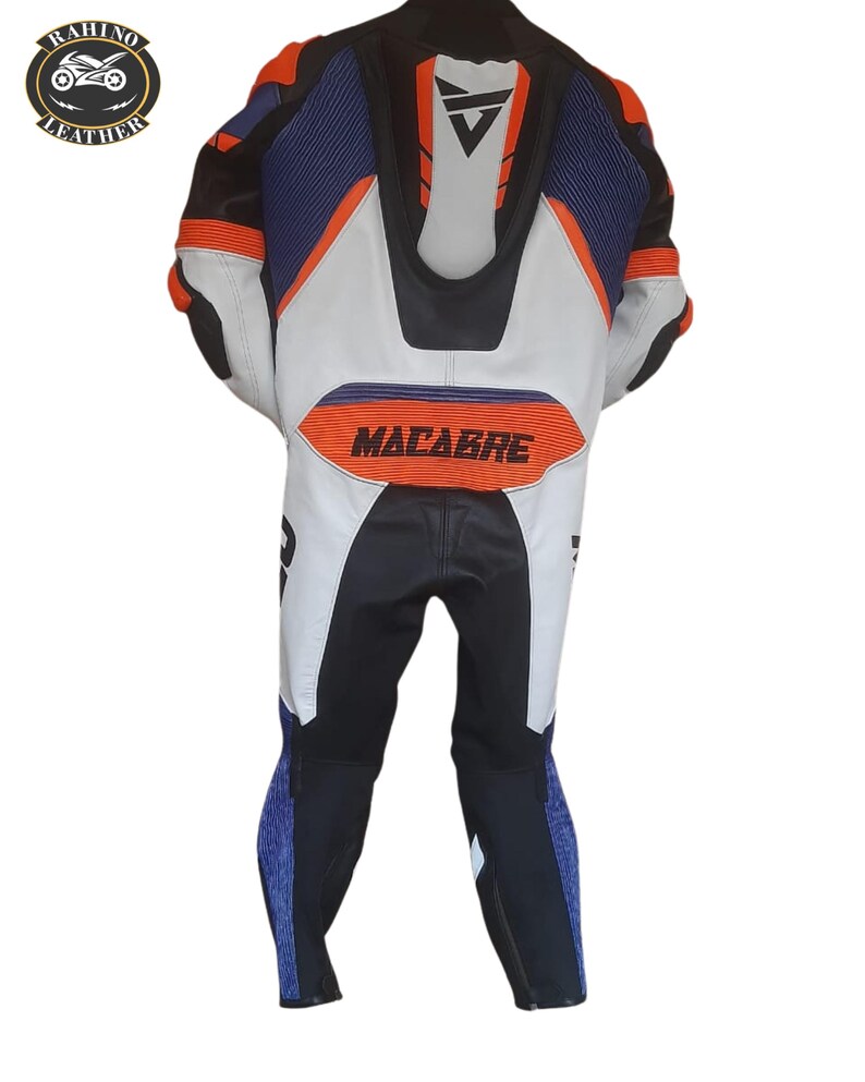 May include: A motorcycle racing suit in black, white, blue, and orange. The suit has a streamlined design with the word "MACABRE" across the back. The suit features a logo on the upper left and is designed for protection and speed.