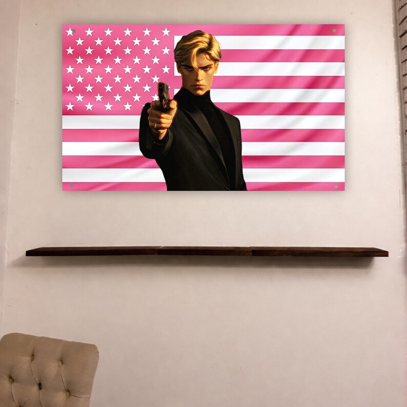 May include: A rectangular wall banner featuring a stylized illustration of a person with blonde hair wearing a black turtleneck and blazer, pointing a handgun forward. The background is a pink and white version of the American flag with stars.