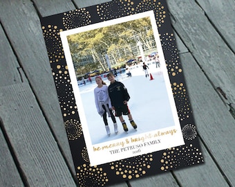 May include: A Christmas card with a black background and gold confetti. The card features a photo of two children ice skating in a winter scene. The text on the card reads "be merry & bright always" and "THE PETRUSO FAMILY 2016".