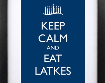 May include: A blue poster with white text that reads "Keep Calm and Eat Latkes". A stylized crown is above the text.