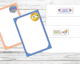 May include: Stationery set featuring a blue and orange bordered notepad with a cartoon cloud and rainbow design. Includes matching envelopes with address labels. The text on the notepad says "Cloudy with a chance of rainbows".