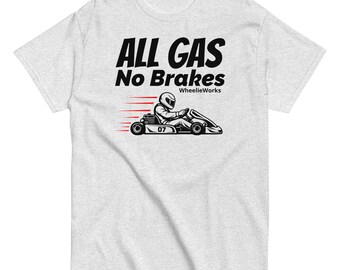May include: A light gray short-sleeve t-shirt featuring a black graphic of a person driving a go-kart with the number 07. The text reads ALL GAS No Brakes and WheelieWorks, accompanied by red horizontal motion lines indicating speed and movement.
