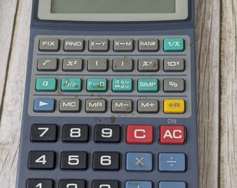 Zabytkowy kalkulator naukowy Casio FX-55 Fraction Mate | Sprawdzony, działający kalkulator z lat 80. z futerałem i instrukcją obsługi