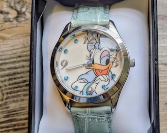 Disney Daisy Duck Armbanduhr mit Steinzifferblatt, mintgrünem Armband, Originalverpackung, funktionsfähig, neue Batterie