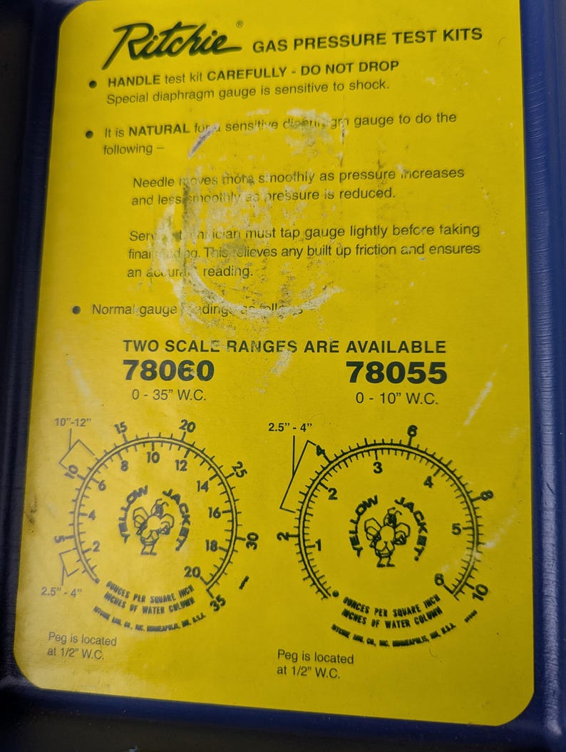 May include: A yellow Ritchie gas pressure test kit with two scale ranges: 78060 (0-35" W.C.) and 78055 (0-10" W.C.). Each gauge features a circular dial with a "Yellow Jacket" logo and measurements in inches of water column.