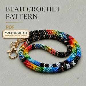 May include: A beaded lanyard featuring a repeating rainbow colour sequence interspersed with black segments, finished with a gold-tone metal lobster clasp. The text reads BEAD CROCHET PATTERN, PDF, MADE TO ORDER, READY WITHIN 48 HOURS.