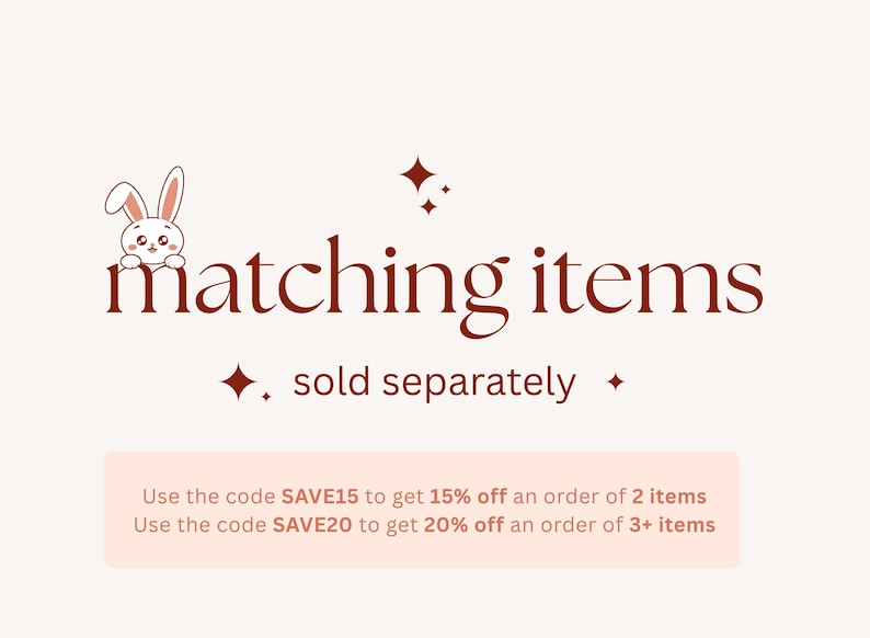 Op de afbeelding: Afbeelding met de tekst "matching items" in donkerrood script, met een kleine konijnenillustratie. De tekst "sold separately" staat eronder. De afbeelding bevat ook een lichtroze rechthoek met tekst.