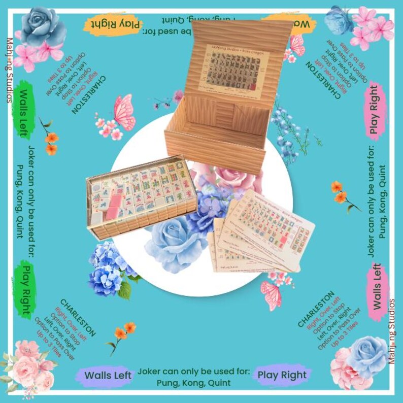 May include: A Mahjong set with bamboo-style boxes and tiles, displayed on a floral-themed game mat. The set includes tiles, a wooden box, and instruction cards. The game mat has text that says "Charleston" and "Play Right".