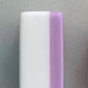 May include: A rectangular block with rounded corners featuring a smooth, glossy finish. The object is divided vertically into two distinct sections, with a larger white portion on the left and a smaller, solid light purple section on the right side.