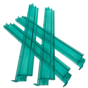May include: Four transparent teal plastic bag sealers are arranged in a crisscross pattern against a white background. Each sealer has a rectangular shape with a ridged design and a small hook at one end. The plastic appears to be a translucent teal color.