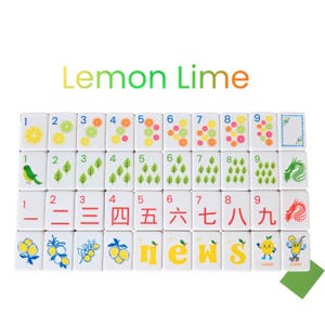 May include: A set of white mahjong tiles arranged in four rows. The tiles feature colorful illustrations of citrus fruits, leaves, birds, dragons, and Chinese numerals. The text "Lemon Lime" appears in a gradient font above the tile collection.