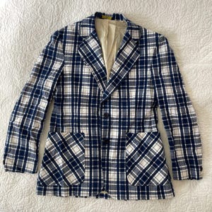 May include: A rustic wooden sign with the text "Welcome to our home" in white lettering. The sign features a distressed finish and a simple, inviting design, perfect for front door decor.