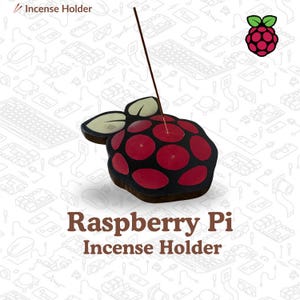 May include: A raspberry-shaped incense holder with a black base and red circular accents. The holder has a leaf-shaped detail and a stick of incense inserted. The text "Raspberry Pi Incense Holder" is displayed below.
