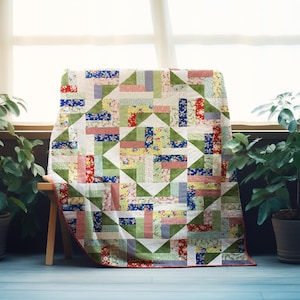 May include: A patchwork quilt with a geometric design in shades of red, blue, green, and yellow. The quilt is made from various floral and patterned fabrics. It is draped over a small wooden bench, in front of a window.